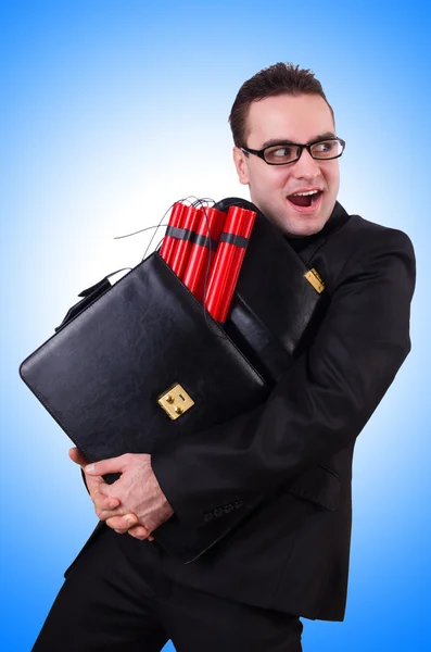 Businessman with dynamite against the gradient — Stock Photo, Image