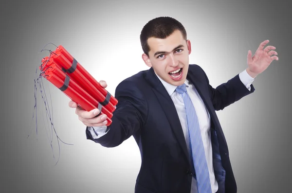 Businessman with dynamite against the gradient — Stock Photo, Image