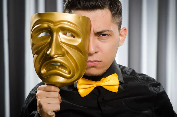 Funny concept with theatrical mask Stock Photo