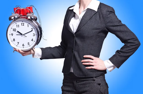 Woman with dynamite and clock — Stock Photo, Image