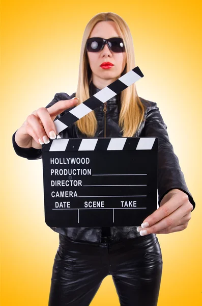 Woman with movie clapper — Stock Photo, Image