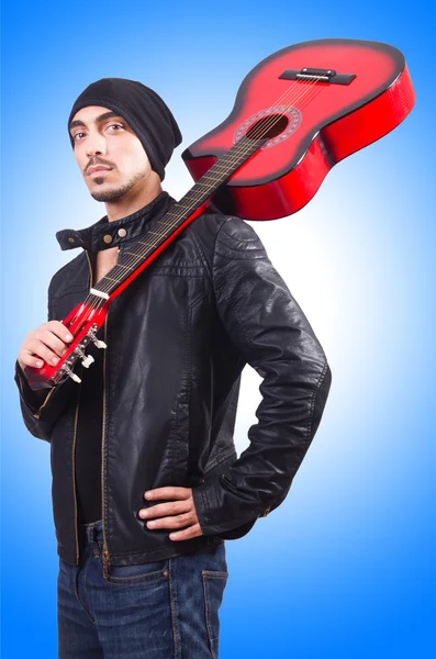 Guitar player against the gradient — Stock Photo, Image