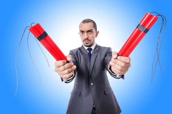 Businessman with dynamite against the gradient — Stock Photo, Image