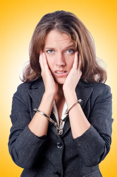 Female businesswoman with handcuffs — Stock Photo, Image