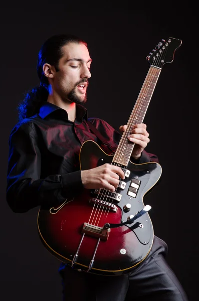 Man with guitar during concert — Stock Photo, Image