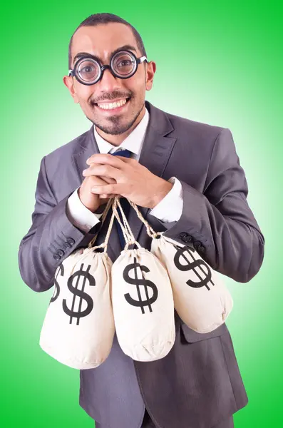 Man med säckar med pengar — Stockfoto