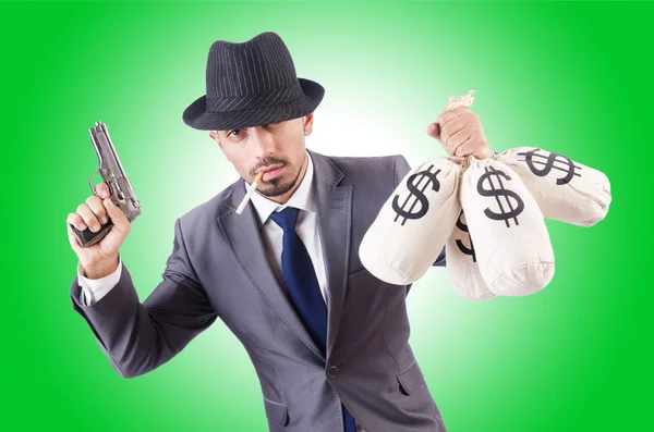 Affärsman kriminell med säckar pengar — Stockfoto