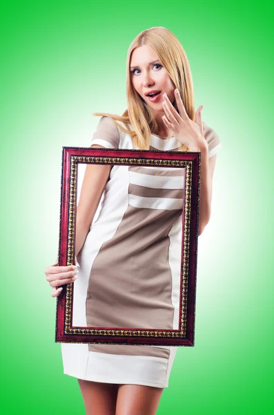 Woman with picture frame — Stock Photo, Image