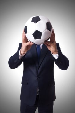 Businessman with football on white