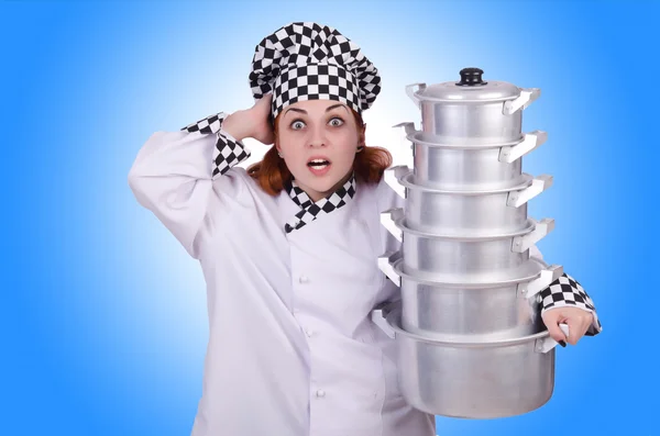 Cook with stack of pots — Stock Photo, Image