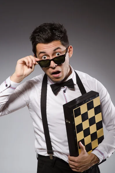 Funny chess player with board — Stock Photo, Image