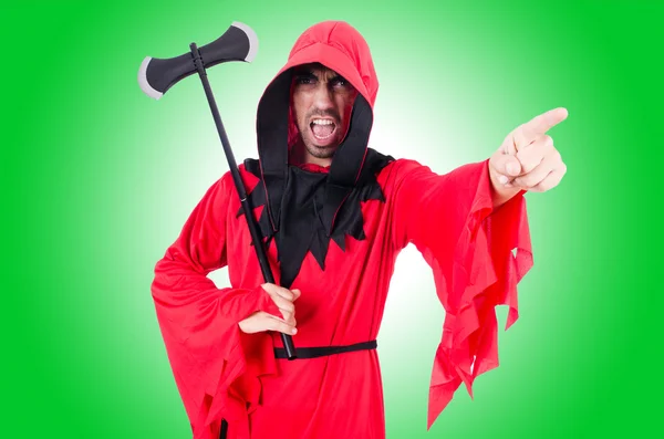 Executioner in red costume with axe — Stock Photo, Image