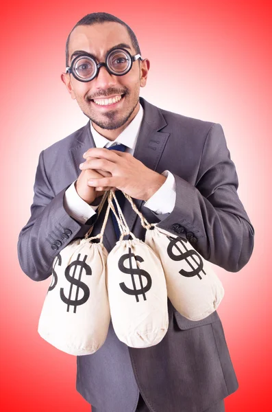 Man with sacks of money — Stock Photo, Image