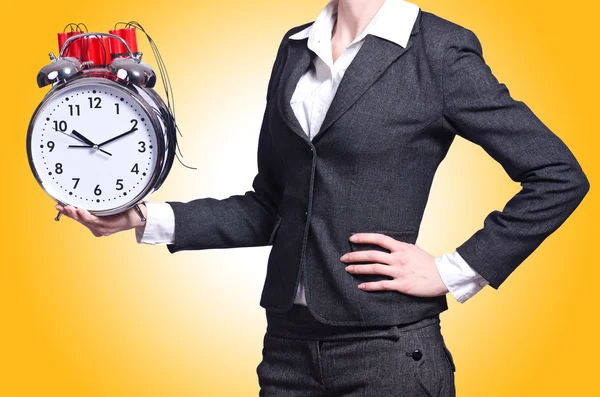 Woman with dynamite and clock — Stock Photo, Image