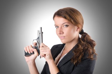 businesswoman with hand gun