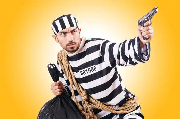 Convict criminal in striped uniform — Stock Photo, Image