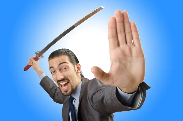 Businessman with sword against the gradient — Stock Photo, Image