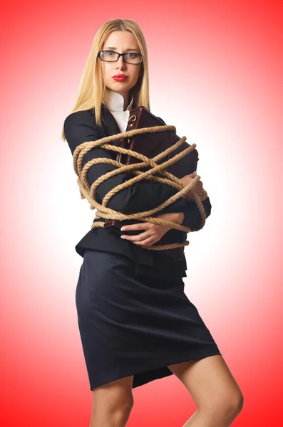 Woman businessman tied up with rope — Stock Photo, Image