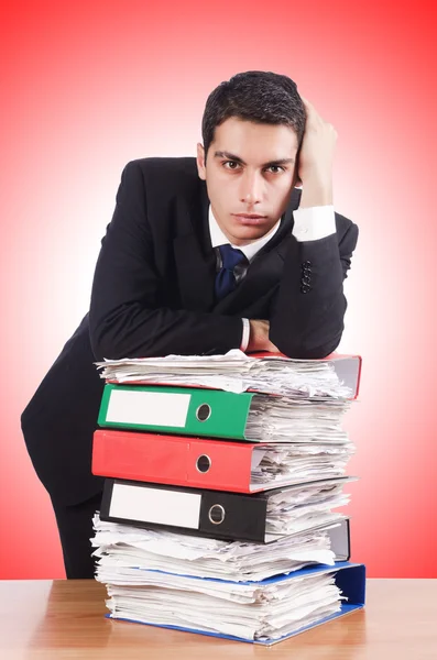 Young busy businessman at his desk — Stock Photo, Image
