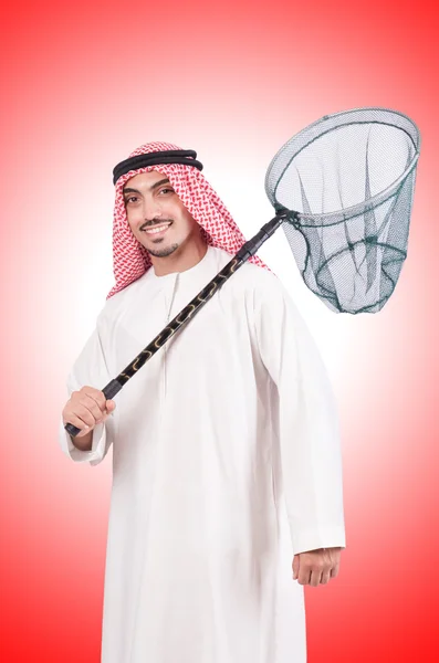 Arab businessman with catching net against the gradient — Stock Photo, Image