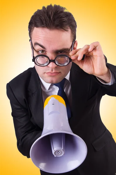 Young businessman with loudspeaker — Stock Photo, Image