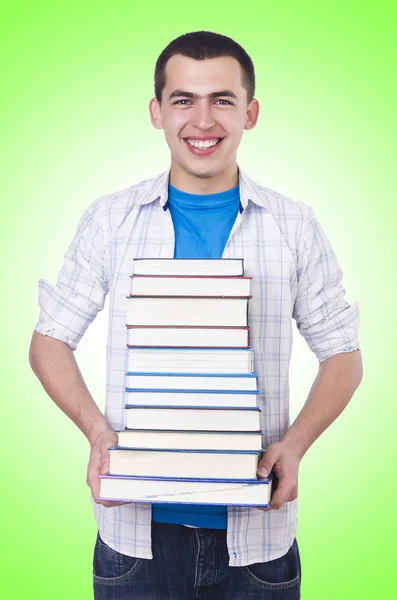 Student with lots of books — ストック写真