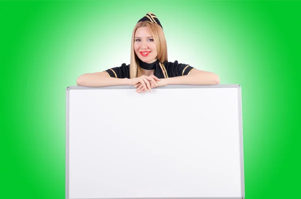 Woman stewardess with blank board — Stock Photo, Image