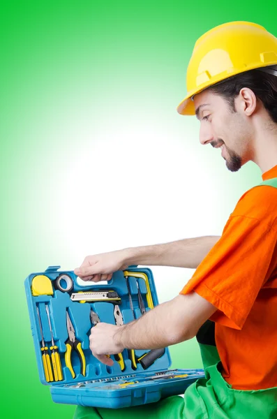 Repairman in coveralls in industrial Stock Picture