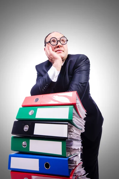 Funny man with lots of folders against the gradient — Stock Photo, Image