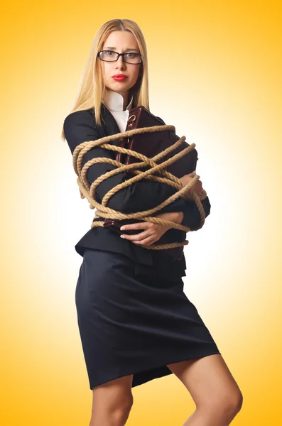 Woman businessman tied up with rope — Stock Photo, Image