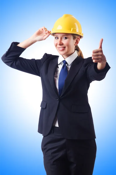 Young businesswoman with hard hat — Stock Photo, Image