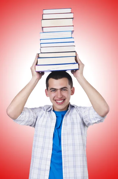 Schüler mit vielen Büchern gegen das Gefälle — Stockfoto