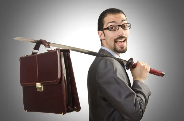 Businessman with sword against the gradient — Stock Photo, Image