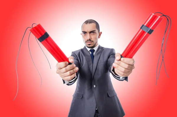 Businessman with dynamite against the gradient — Stock Photo, Image