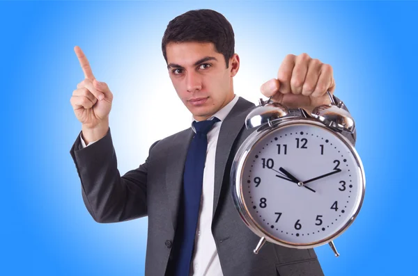 Uomo d'affari con orologio isolato su blu — Foto Stock