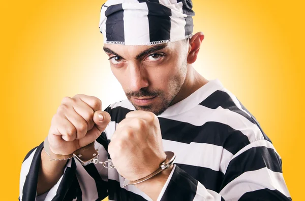 Convict criminal in striped uniform — Stock Photo, Image