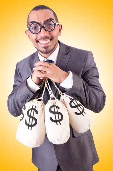 Man met zakken geld. — Stockfoto