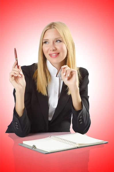 Businesswoman sitting at the desk — Stock Photo, Image