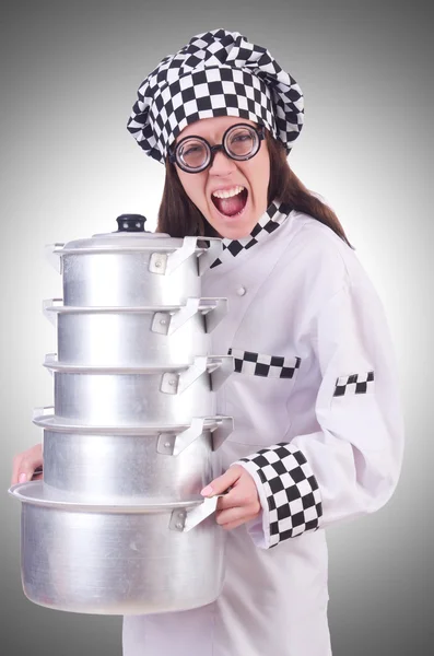 Cook with stack of pots — Stock Photo, Image