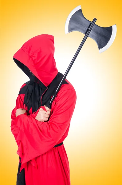 Executioner in red costume with axe — Stock Photo, Image