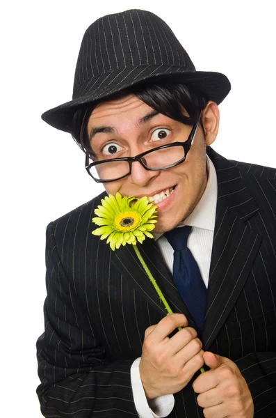 Jonge man in zwart kostuum met bloemen — Stockfoto