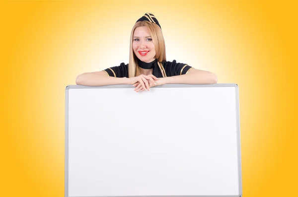 Woman stewardess with blank board — Stock Photo, Image