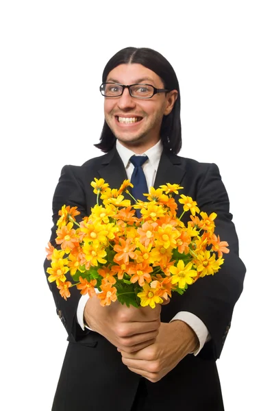 Stilig affärsman med blomma isolerad på vit — Stockfoto