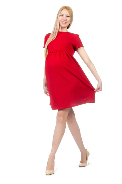 Hübsche schwangere Frau im roten Kleid — Stockfoto