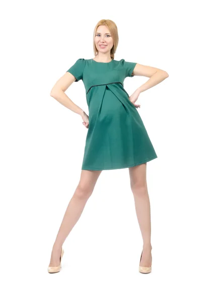 Schöne schwangere Frau in grünem Kleid isoliert auf weiß — Stockfoto