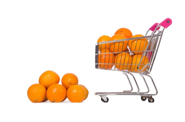 Supermarket trolley full of oranges isolated on white — Stock Photo, Image