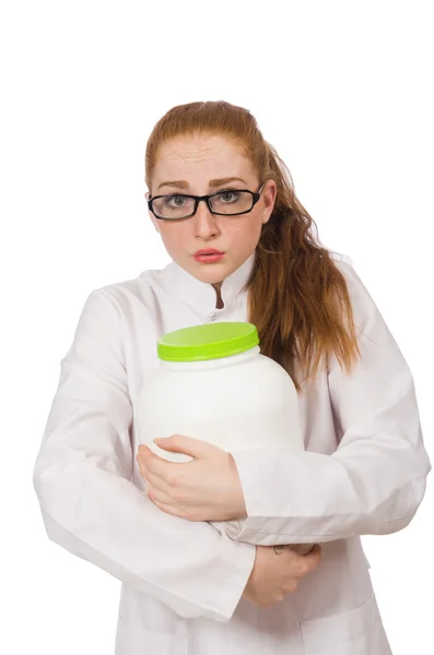 Young female doctor holding jar of protein isolated on white — Stock Photo, Image