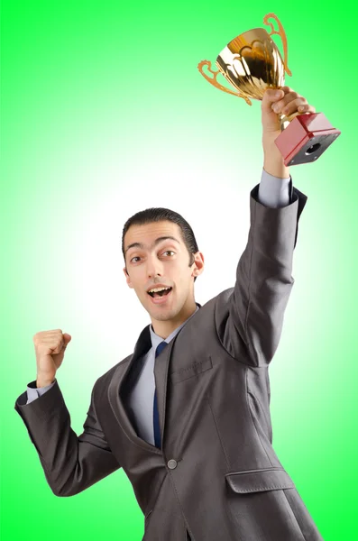 Man being awarded with golden cup Royalty Free Stock Photos