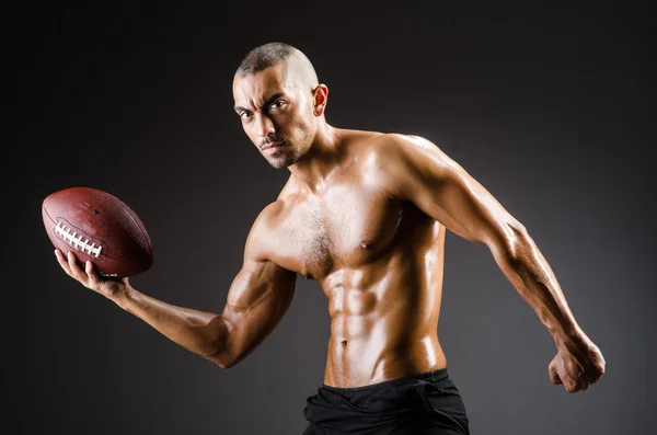 Muscular football player — Stock Photo, Image