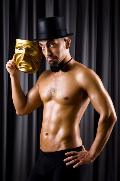 Muscular actor with theatrical mask — Stock Photo, Image